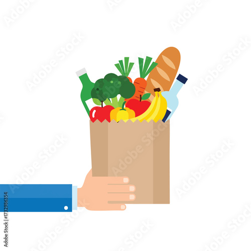 Hand holding a paper grocery bag filled with fresh fruit vegetables bread and drinks.