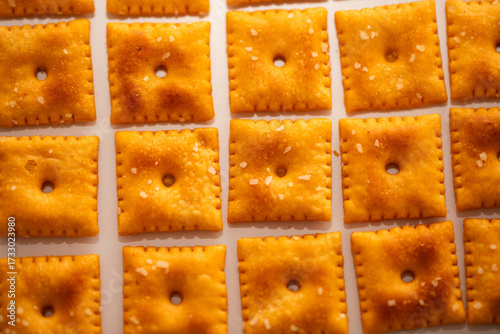 Closeup of Square Salted Cheez it Crackers on white background lined up
