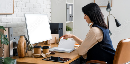 Young woman reading book an...