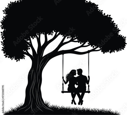 Romantic silhouette of a couple embracing on a tree swing under a large spreading tree
