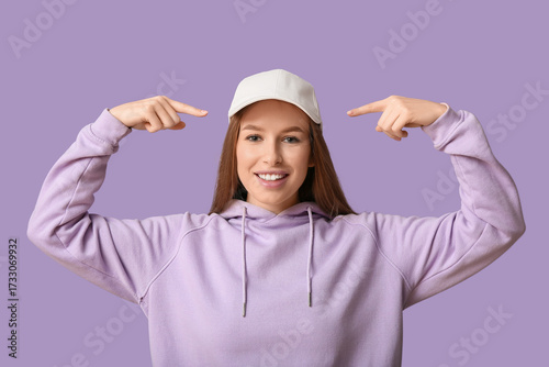 Beautiful young woman point...