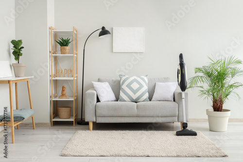 Modern vacuum cleaner on ca...