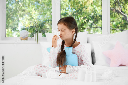 Sick little girl with hot w...