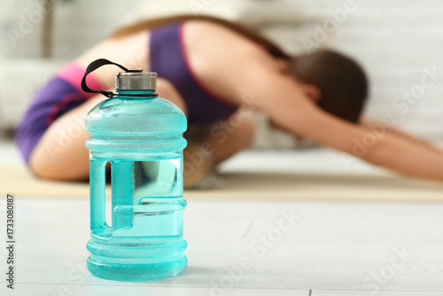 Bottle of water on floor ag...