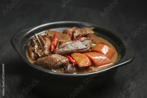 Braised Duck and Turnip Stew in Iron Skillet - Traditional Farmhouse Comfort Food Dish