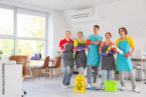 Team of smiling young janit...