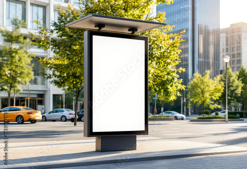 Vertical billboard mockup, brushed aluminum extrusion frame 40 mm, poster vinyl 0.25 mm matte laminated, size 1000×1600 mm portrait, installed on concrete pavement at bus stop, background with cars 