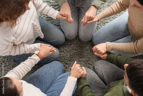 Group of people praying on ...