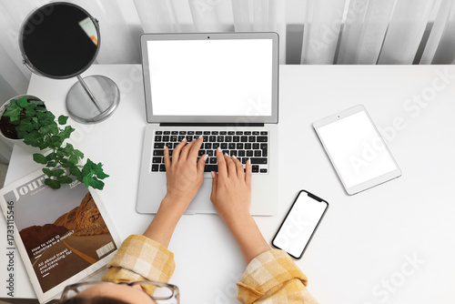 Young woman using blank lap...