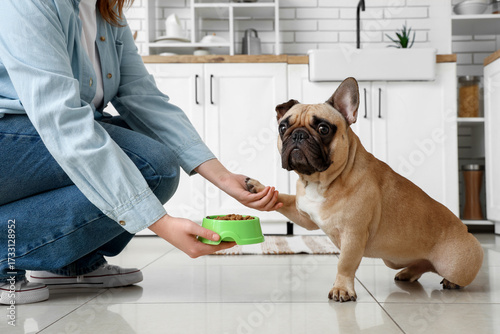 Woman giving feeding bowl w...
