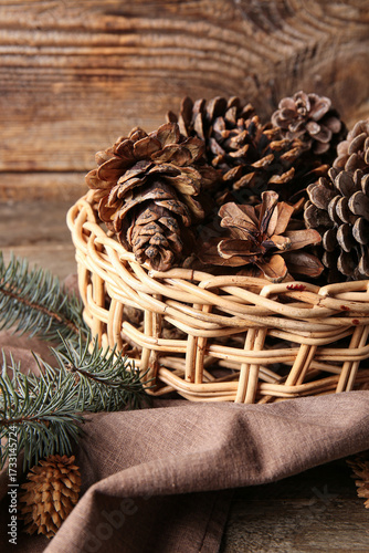 Wicker bowl with pine cones...