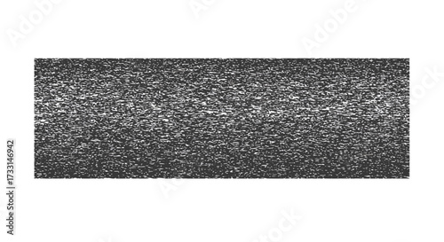 Detailed closeup of a textured dark gray rectangular surface with subtle variations.