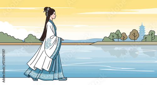 An elegant woman in traditional attire walks beside a serene lake, reflecting the sky.