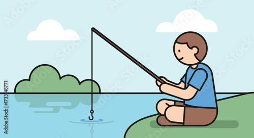 A young boy sitting on a grassy riverbank fishing.