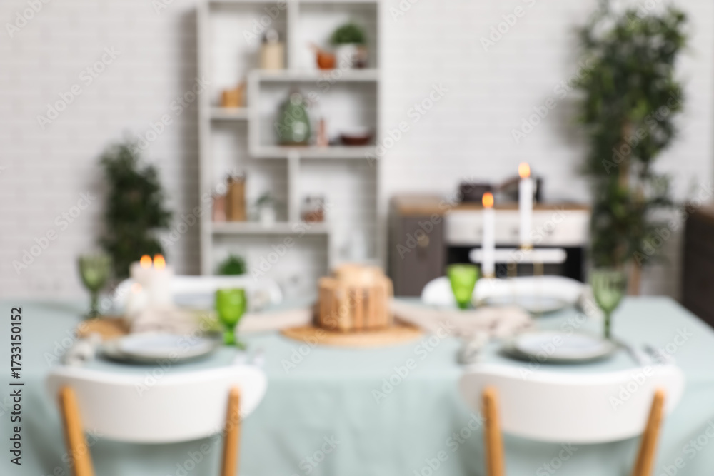 Obraz premium Stylish table setting for dinner in kitchen, blurred view