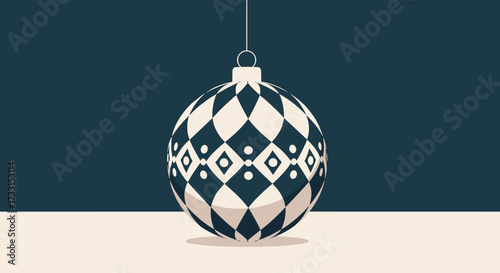 A festive holiday ornament with a geometric diamond pattern hangs suspended against a dark blue background.