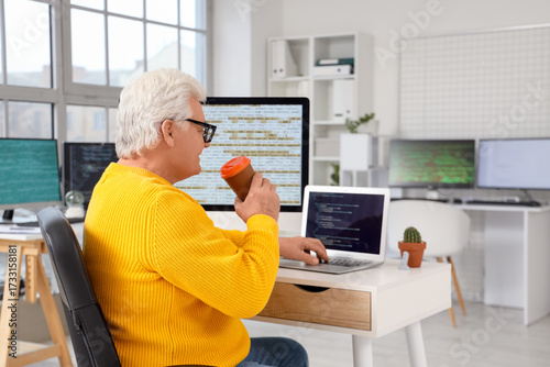 Senior programmer with coff...