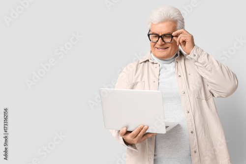 Senior programmer with lapt...