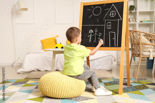 Cute little boy drawing fam...