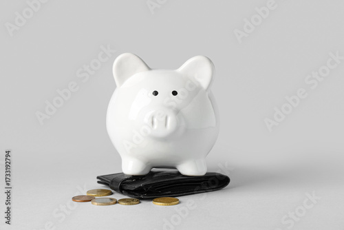 White piggy bank with coins...