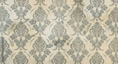 A vintage damask wallpaper pattern with a distressed, aged appearance and a repeating motif.