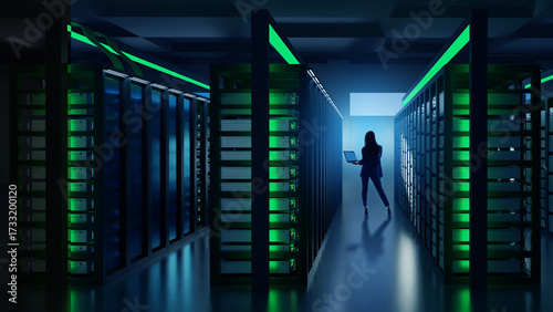 Woman with laptop walking t...