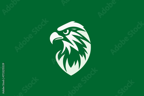 Dynamic stylized white eagle head profile logo or emblem design on a vibrant green background, symbolizing strength, leadership, and freedom.