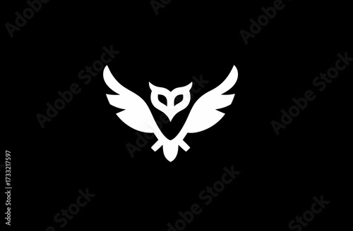 Abstract white owl icon on a stark black background. Simple elegant bird symbol, vector illustration for design.
