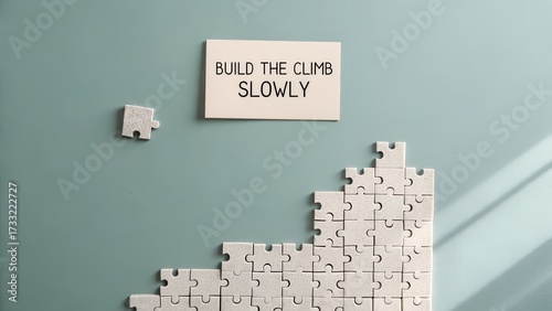 Puzzle pieces building steps with motivational text above