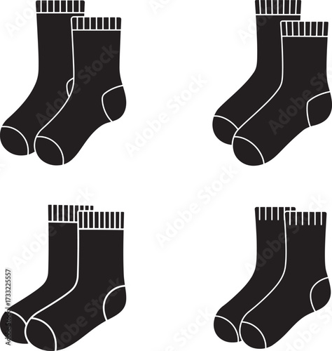 Four pairs of black socks arranged in a simple grid pattern