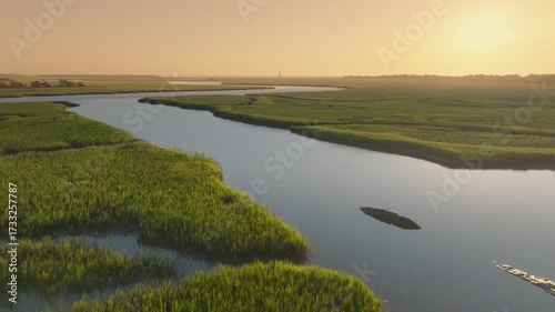 Lowcountry Light: Sunrise Over Charleston, South Carolina Marsh with Water and Lighthouse