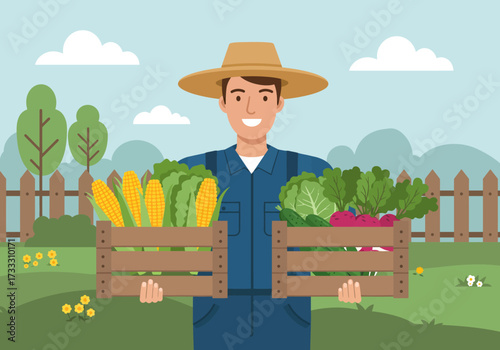 Farmer holding crates of fresh vegetables and corn in a field.