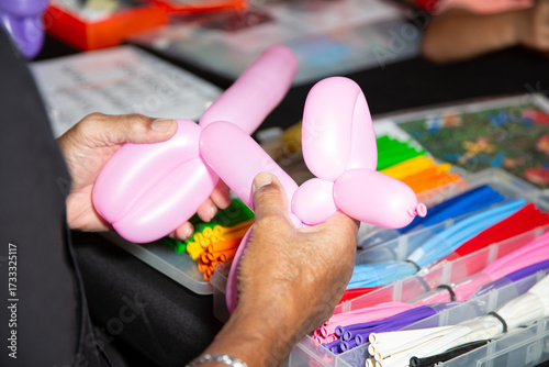 A view of a person making balloon animals.