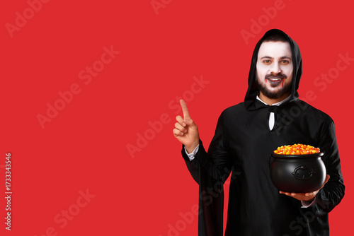 Young man dressed as vampir...