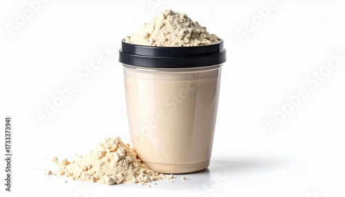 Plastic cup filled with beige protein shake, topped with powder, black lid, fitness nutrition concept.
