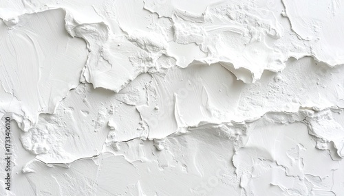 Close-up of textured white surface with ridges, shadows, and rough edges