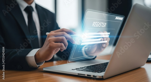 Online Registration Concept Businessman Completing Digital Form on Laptop Representing Account Creation and Access to Services in a Modern Office Setting