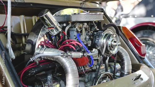 Close Up of Classic Vintage Car Engine with Chrome and Mechanical Parts