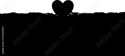 Elegant black heart silhouette emerging from textured ground symbolizing love and growth for romantic or abstract concepts