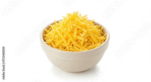 Bowl of freshly grated cheddar cheese on a white background.