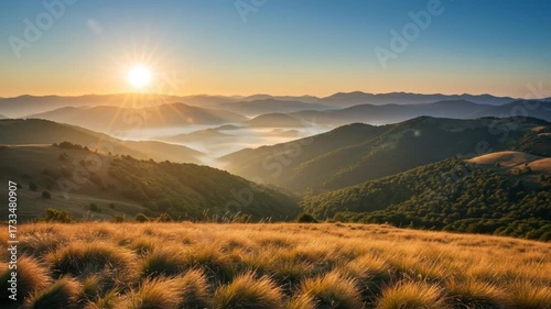 Golden Sunrise Over Misty Mountain Valley.