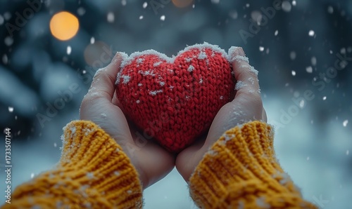 Hands holding a knitted red heart against a snowy background, symbolizing love, warmth, and friendship. The image evokes the feelings of care and emotional support during the winter, Generative AI