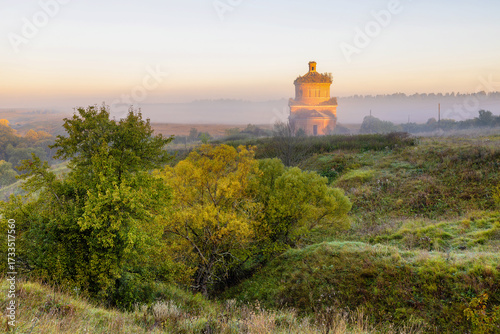 Abandoned church of Michael the Archangel in morning mist, Tula region