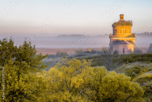 Abandoned church of Michael the Archangel in morning mist, Tula region