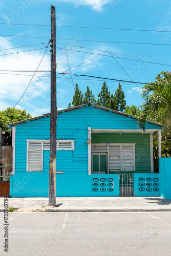 Pedernales, Dominican Republic, 8 august 2025. Typical Dominican Caribbean house made of wood, painted a bright blue color.