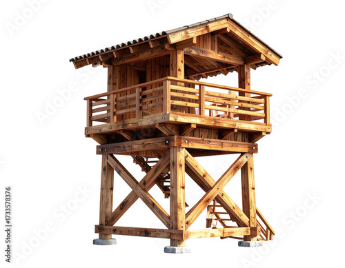 Wooden two-story tower with balcony, staircase, and pitched roof against a black backdrop
