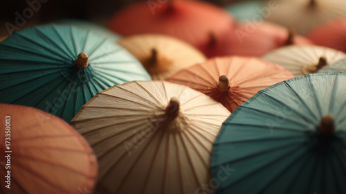 Colorful paper umbrellas arranged together in a vibrant display at a market during the afternoon