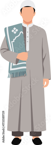 Muslim man in a light grey thobe and white cap holding a patterned grey prayer rug over his shoulder, ready for salah or daily worship