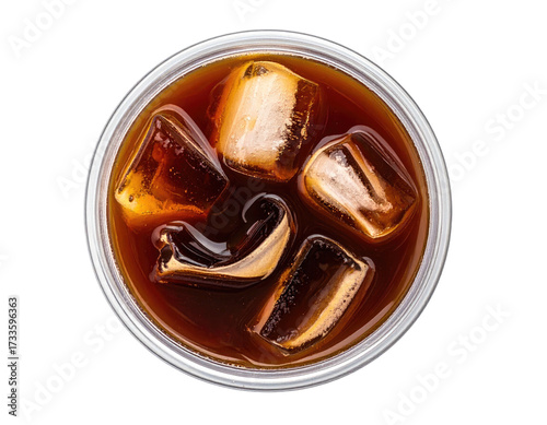 Overhead view of cold drink in a clear cup, with ice cubes floating in liquid