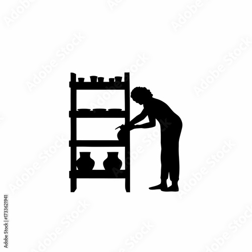 Silhouette of craft seller arranging pottery on wooden shelves isolated on white background